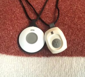 Bay alarm medical and GetSafe medical alert help button pendants shown side-by-side for comparison.