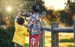 kids blowing bubbles