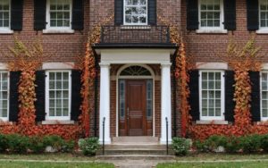 brick home with lots of windows