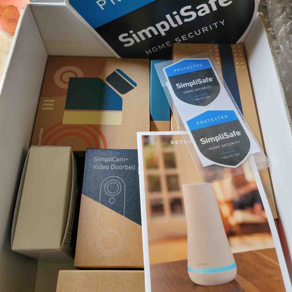 Box full of SimpliSafe equipment.
