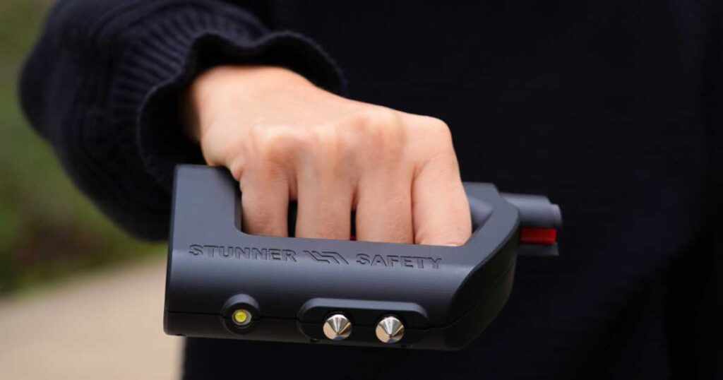 Woman holding The Stunner by Stunner Safety. Click to read an interview with the product's inventor.