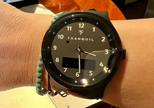 SafeWise tester modeling the Tranquil GPS watch for on their wrist.