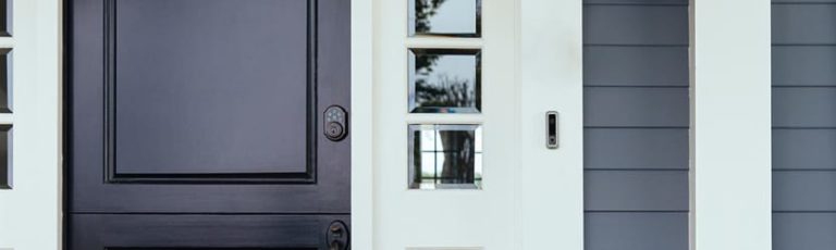 Vivint smart lock and smart doorbell on the front of a house.