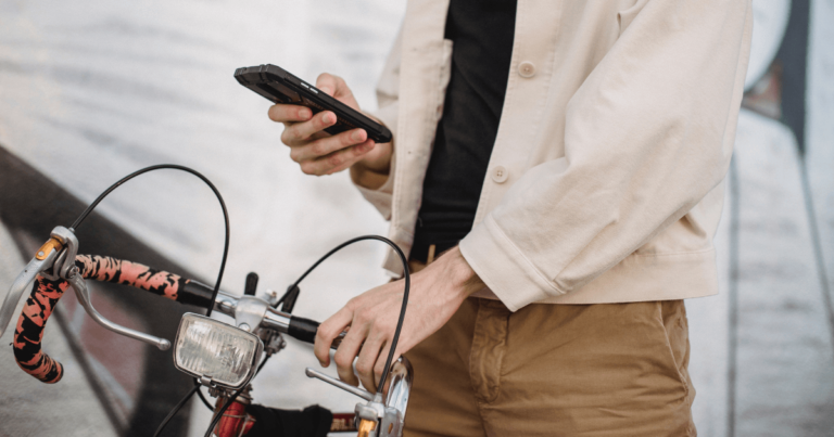 person standing by bike with a light