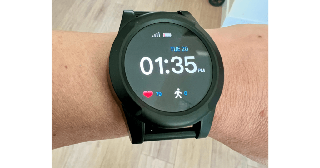 The LifeFone Safe Watch Active showing its interface with time, weather, and a heart rate display.