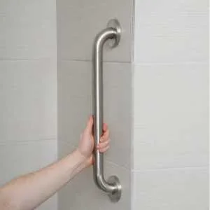A hand grabbing a bar in the shower to prevent slipping in the bathroom. Get details and pricing in Amazon.