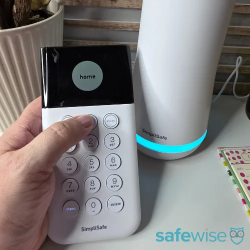 Arming the SimpliSafe keypad during testing.