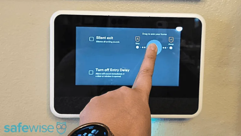 A person arming the Vivint system using the hub.