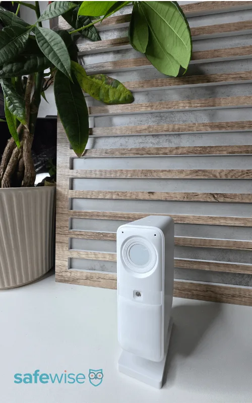 SimpliSafe Indoor Camera on shelf.