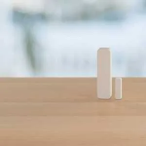 One Verisure shock detector on a table.
