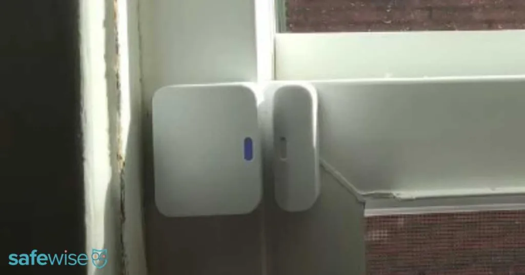 SimpliSafe window sensor installed on a window.
